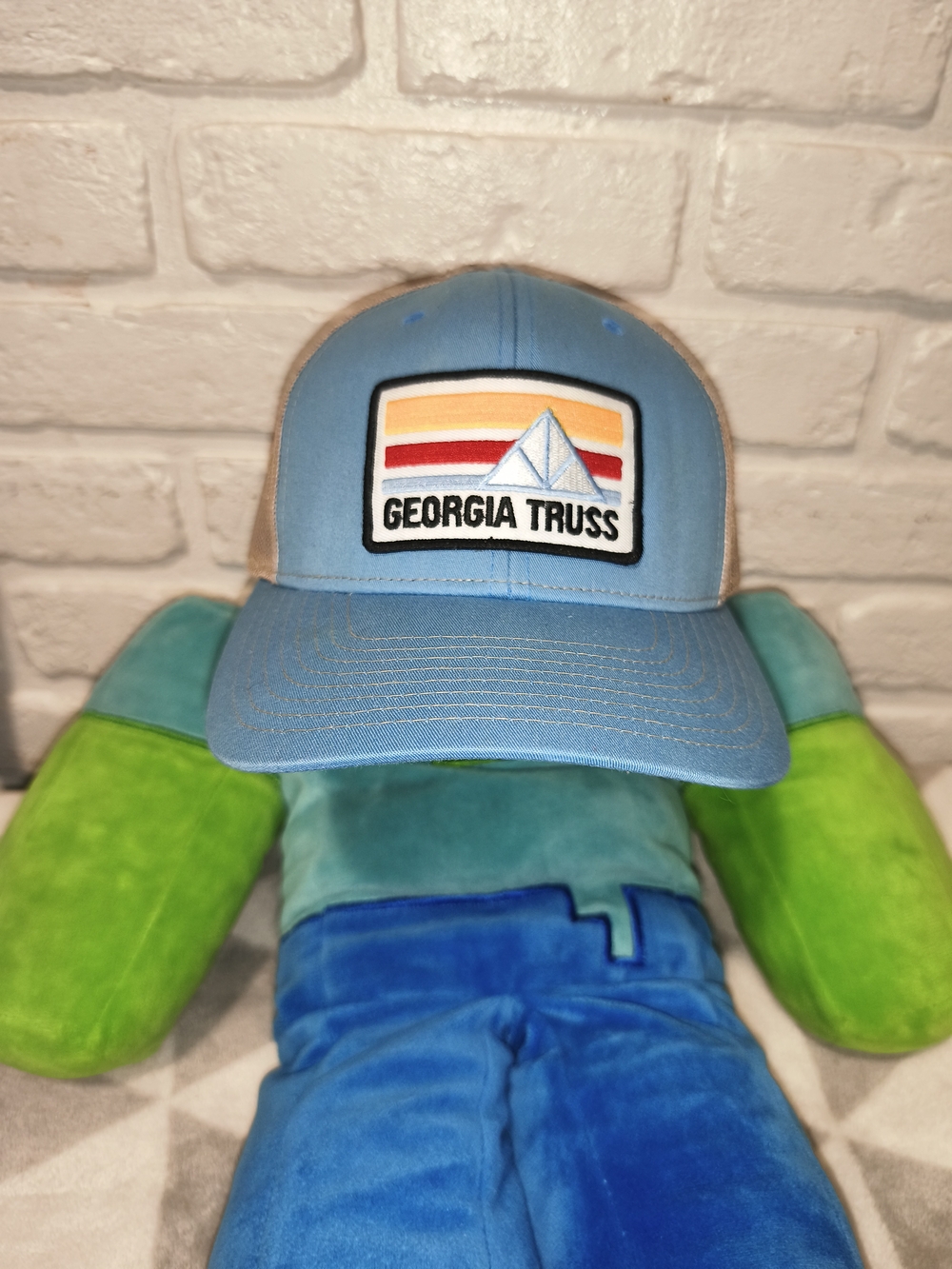 Richardson trucker hat with a stylized mountain scene and "GEORGIA TRUSS" text.